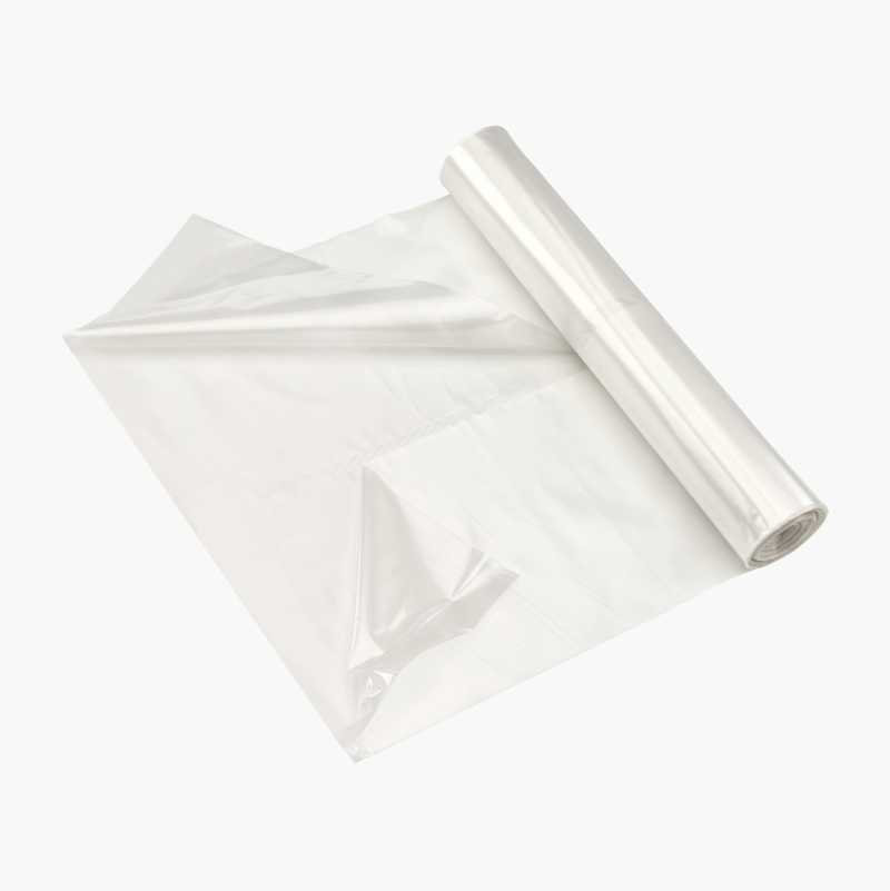 Partially unrolled roll of clear plastic sheeting.