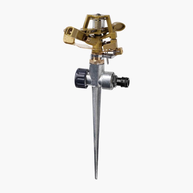 A brass garden sprinkler on a metal spike.