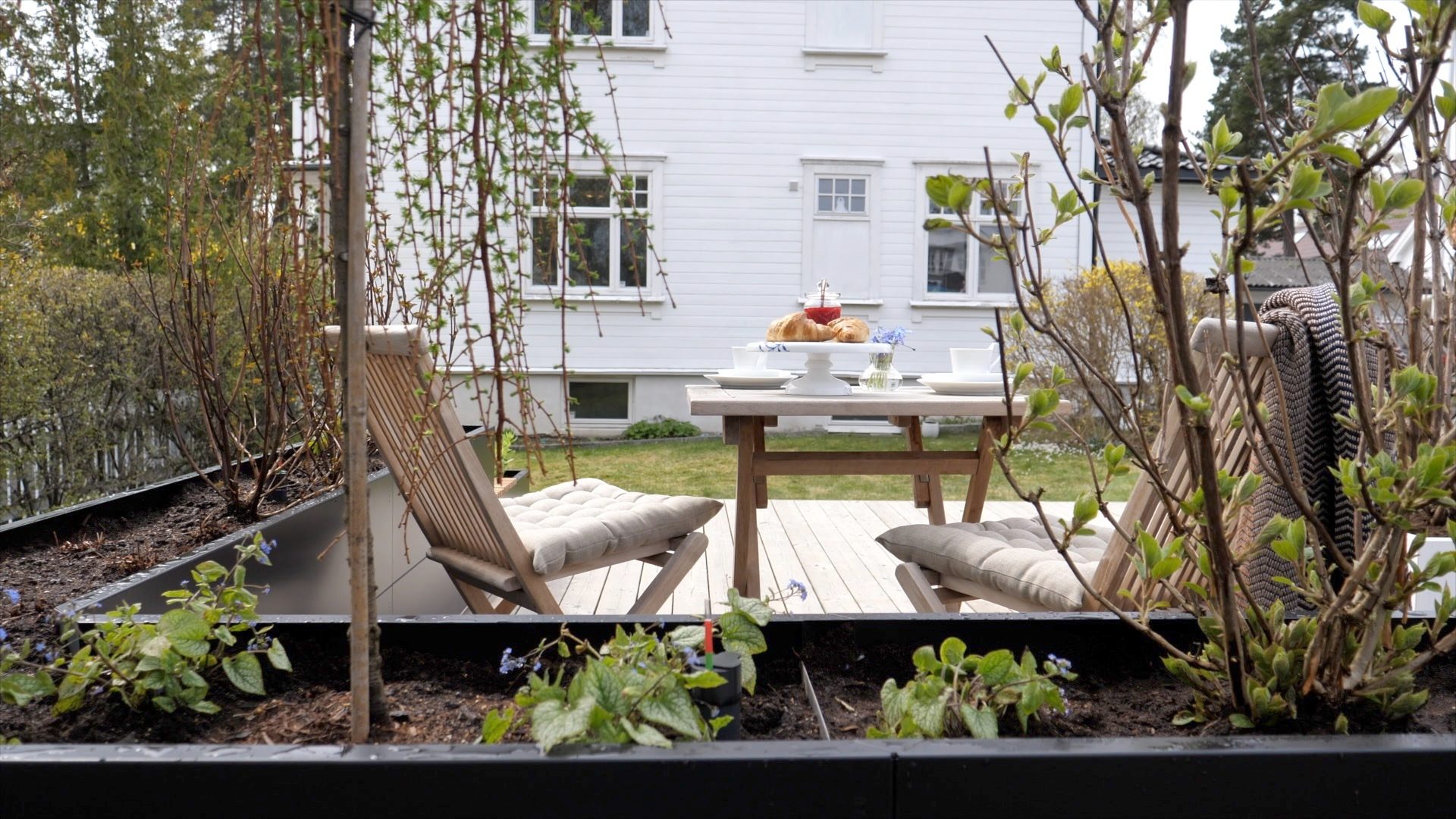 Plant community, Outdoor furniture, Interior design, Window, Building, Table, Shade, Tree