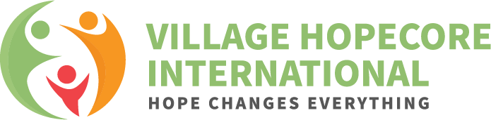 Logo for Village Hopecore International, featuring abstract figures and the tagline 'Hope Changes Everything'.