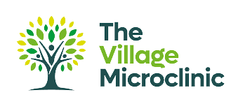 Logo for The Village Microclinic: a stylized tree with green/yellow leaves and human figures, next to the clinic name.