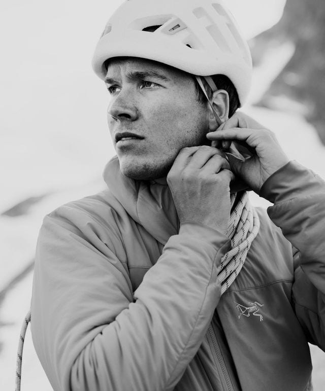 Bicycle helmet, Flash photography, Sports gear, Outerwear, Sleeve, Cap, Gesture, Style, Black-and-white