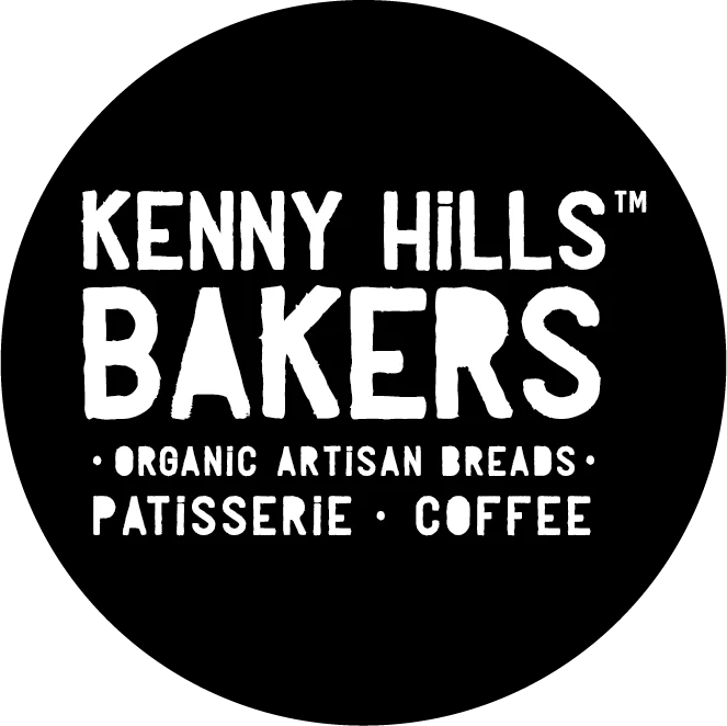Kenny Hills Bakers logo: white text on black circle. Organic artisan breads, patisserie, coffee.