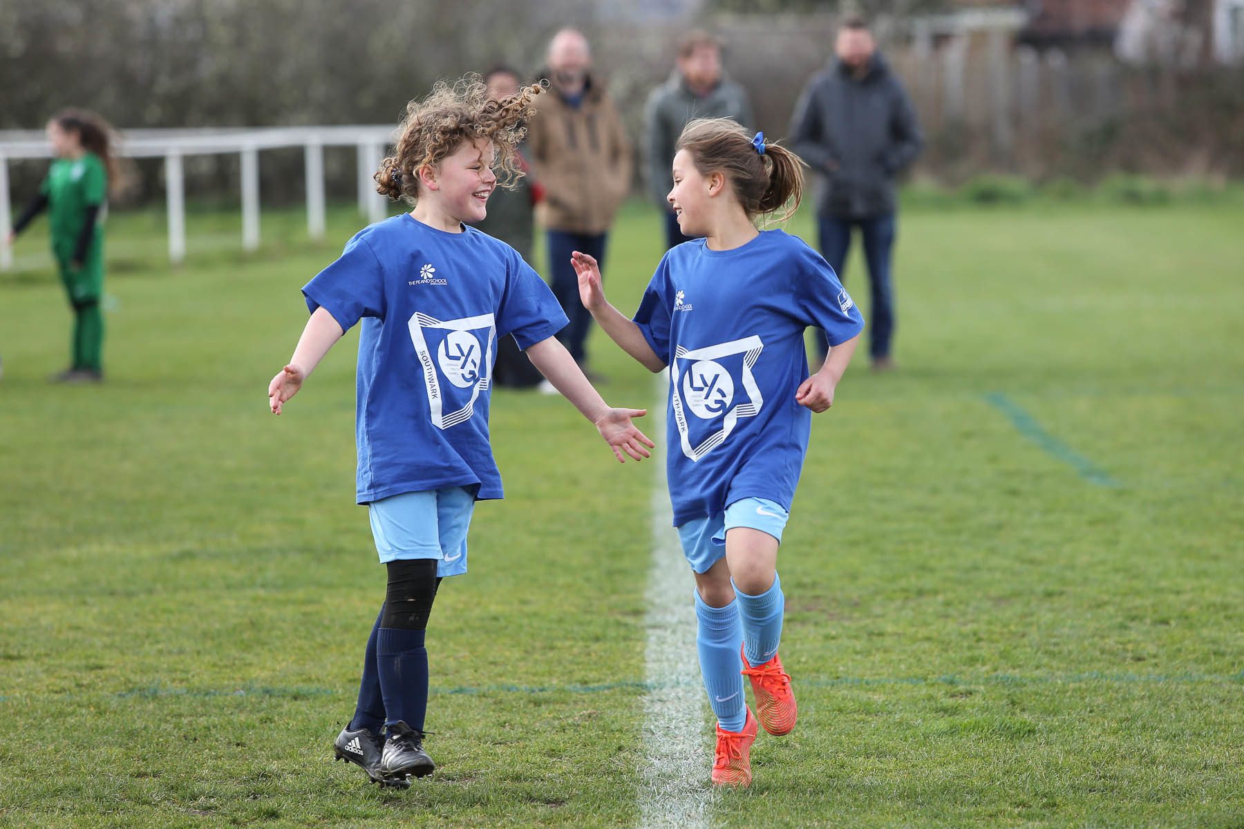 2 girls look at each other with excitement