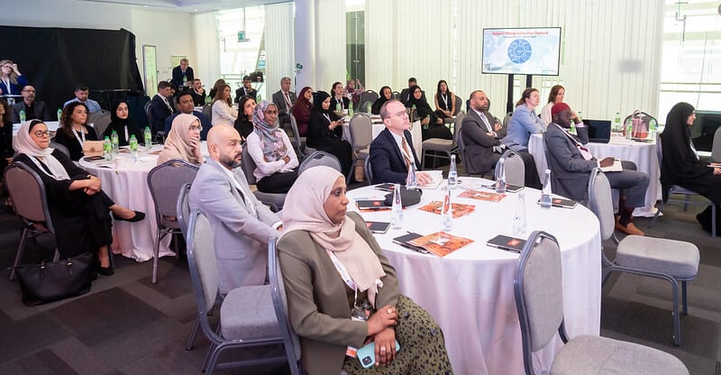 Social group, Furniture, Outerwear, Event, Chair, Crowd, Suit, Interaction, Meeting, Coat