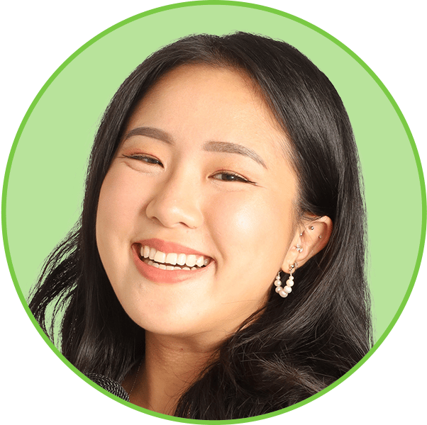 Smiling woman headshot in a green circle frame.