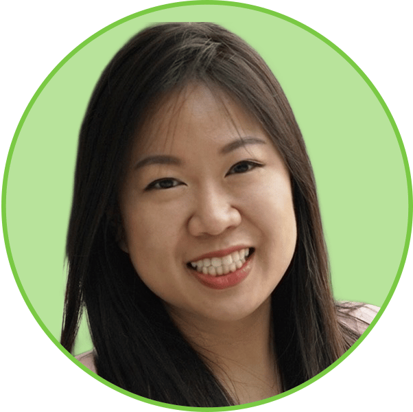 Smiling Asian woman with long dark hair in a green circular frame.