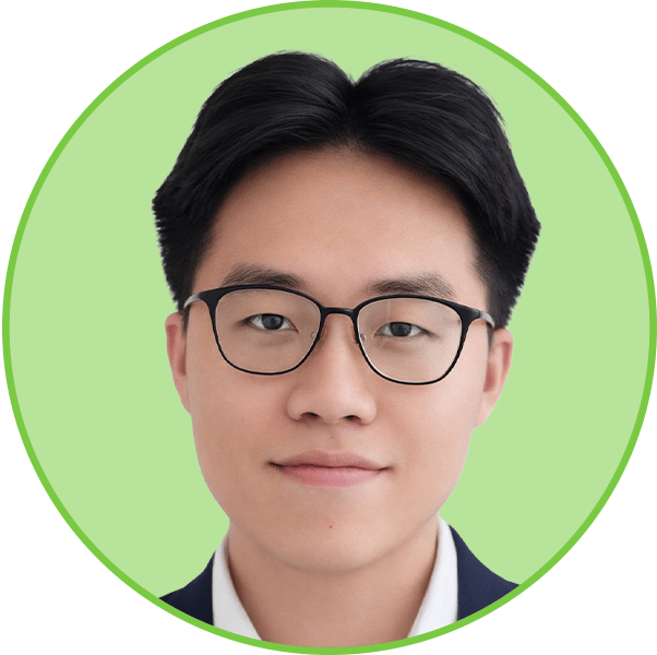 Headshot of a young Asian man wearing black-rimmed glasses, looking directly at the camera with a slight smile.