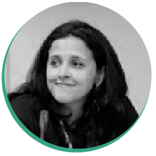 Black and white headshot of a smiling woman.