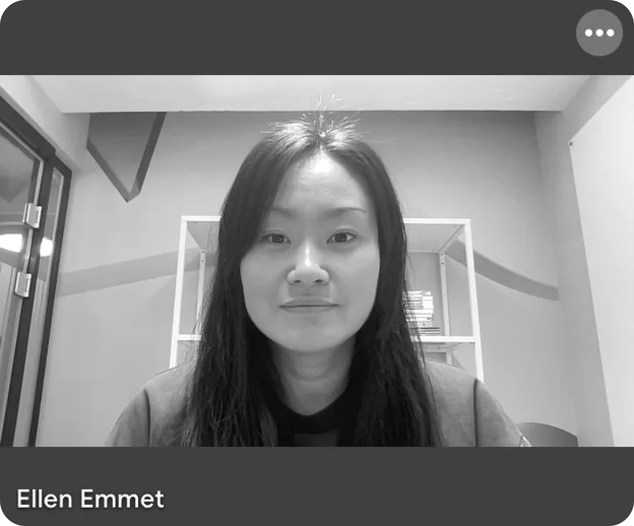 Black and white portrait of Ellen Emmet, a woman with long dark hair, looking at the viewer.