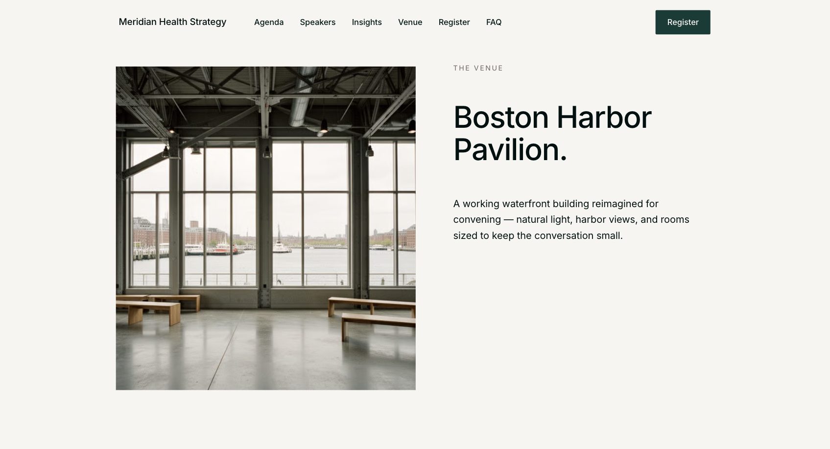 Interior of Boston Harbor Pavilion with large windows overlooking a harbor, wooden benches, and natural light.