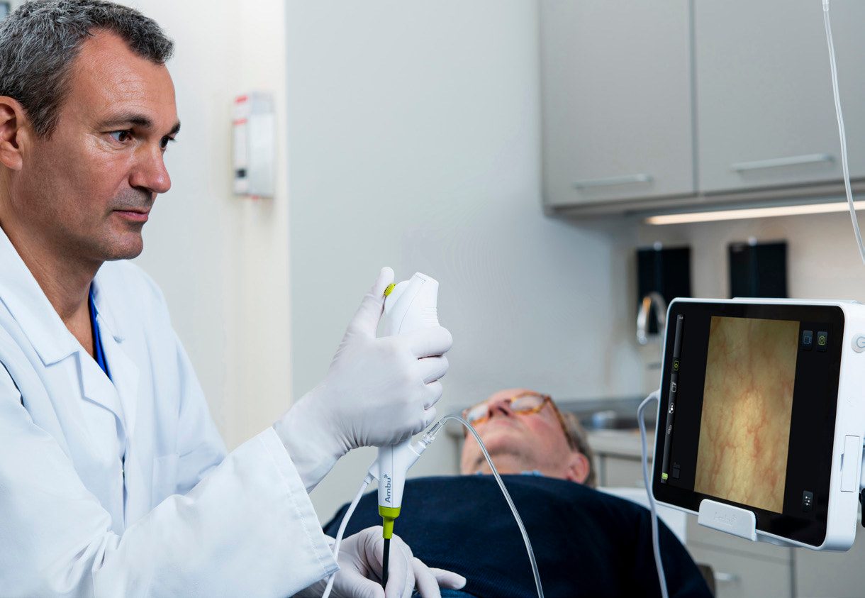 Health care provider, Safety glove, Medical assistant, White coat, Shoulder, Gesture