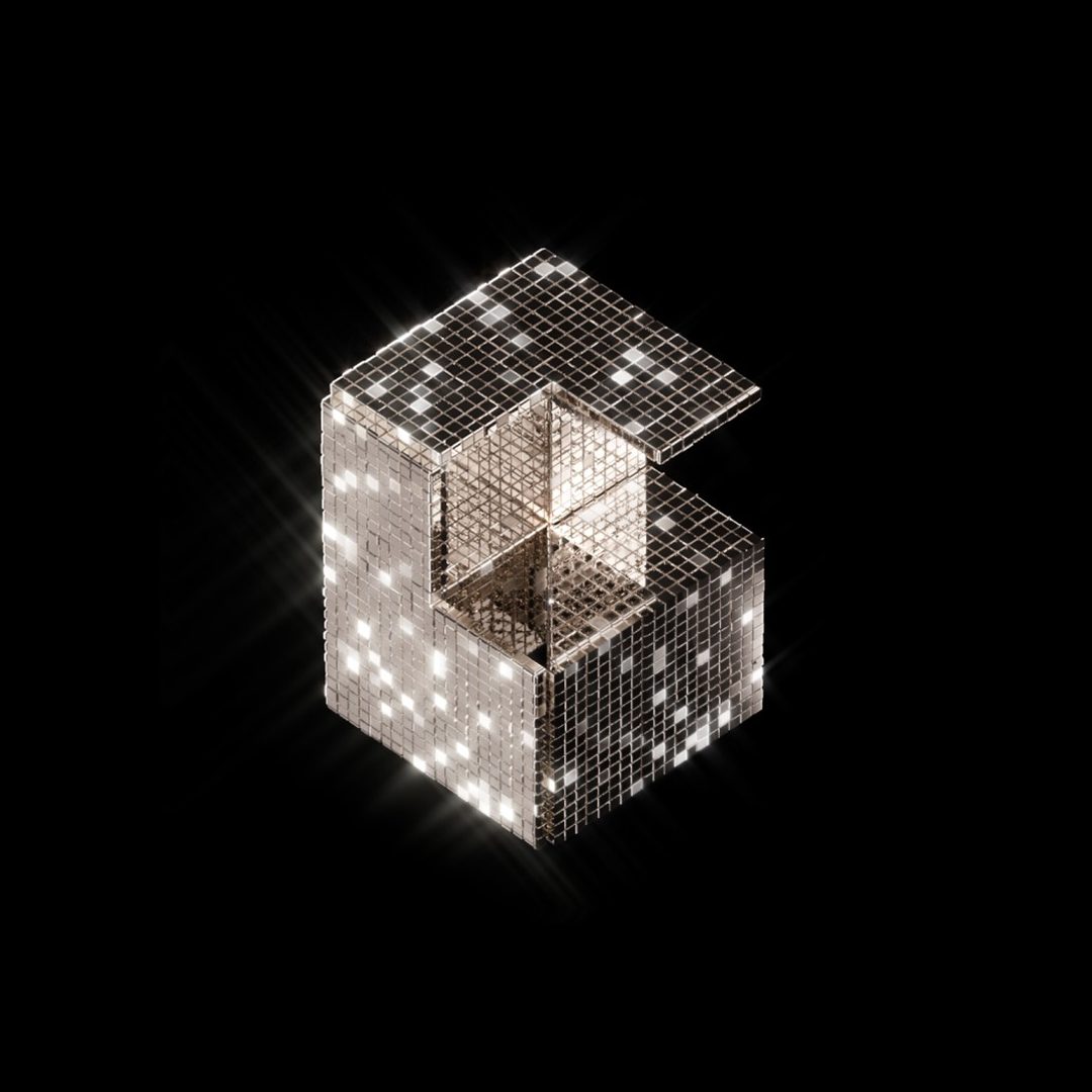 A C-shaped object made of shimmering mirror tiles, emitting light on a black background.