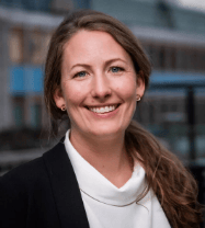 Smiling woman with long brown hair in a professional headshot.