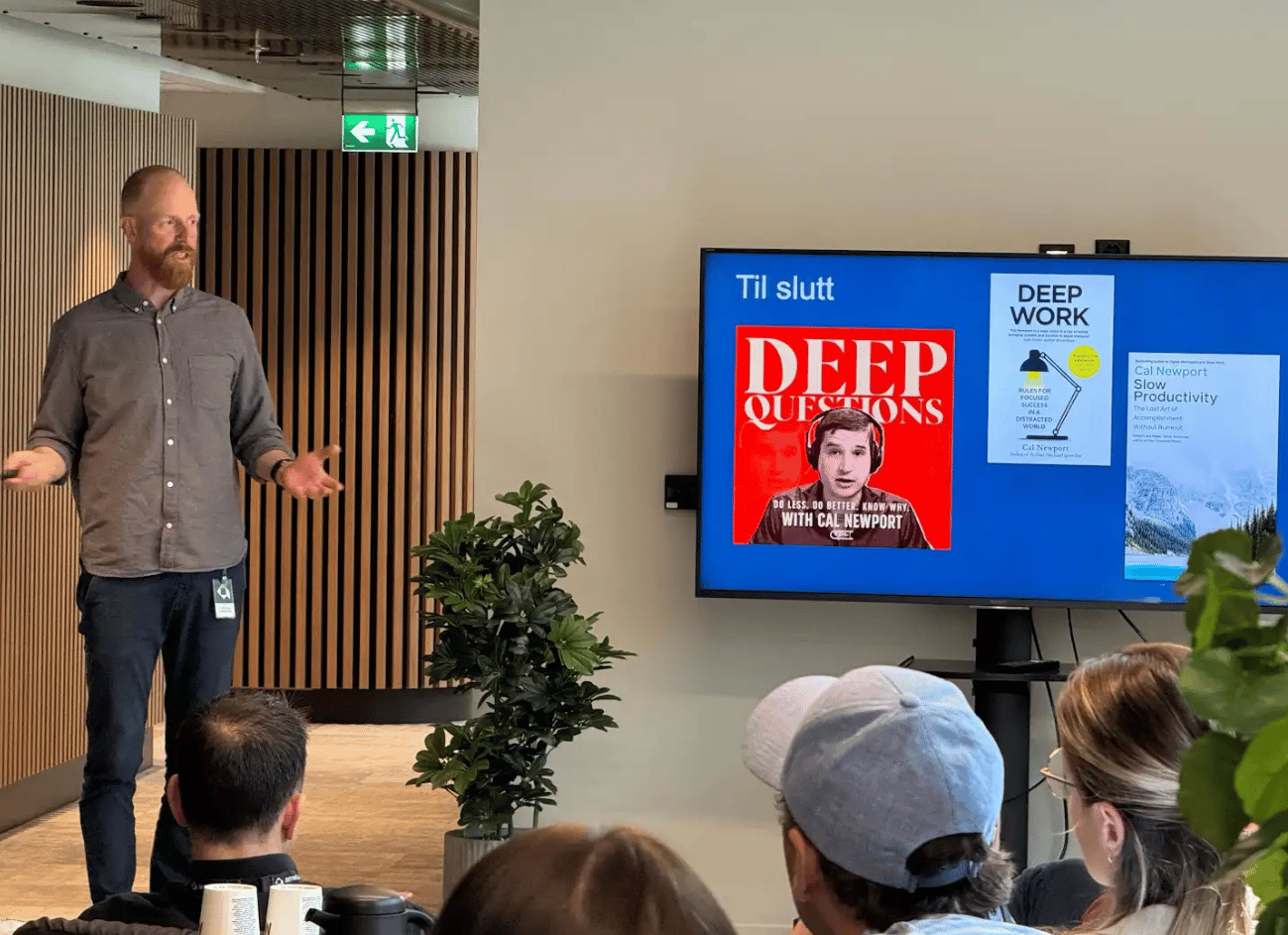 Speaker presents Cal Newport's "Deep Work," "Deep Questions," "Slow Productivity" on screen.