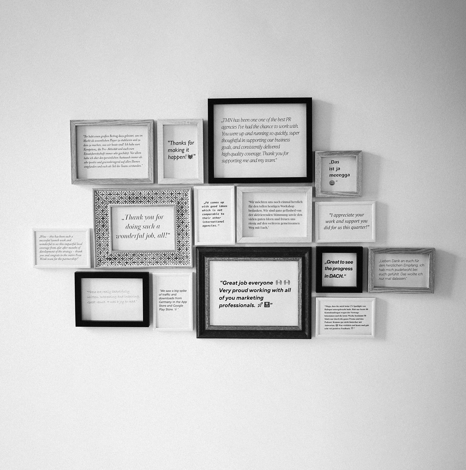 A wall adorned with multiple framed positive testimonials and appreciation messages.