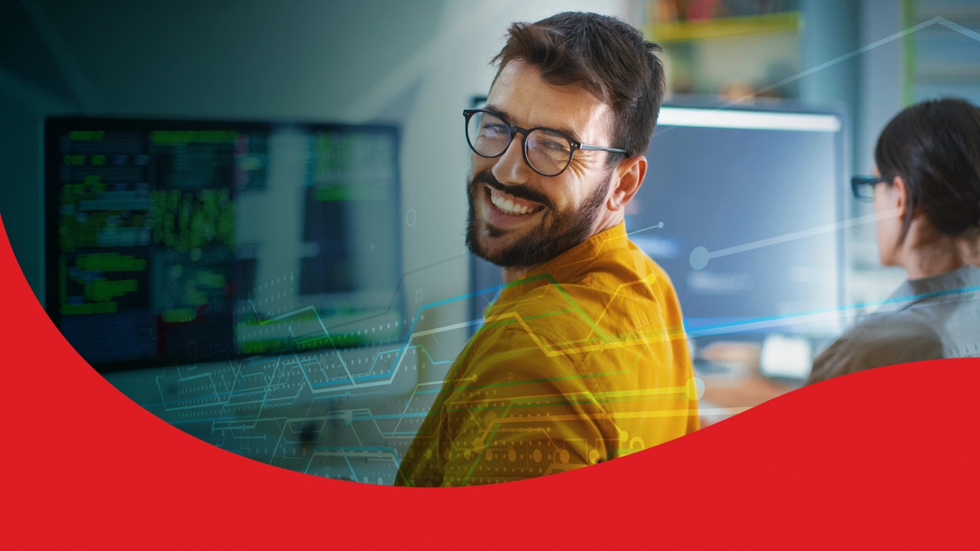 Smiling man in glasses in a tech office, with abstract data graphics and red banner.