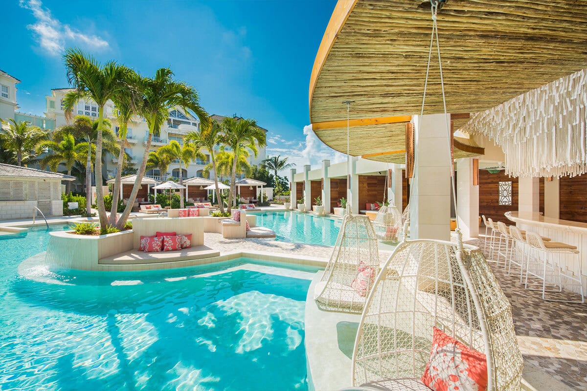 Swimming pool, Seaside resort, Water, Cloud, Sky, Property, Building, Plant, Azure, Chair