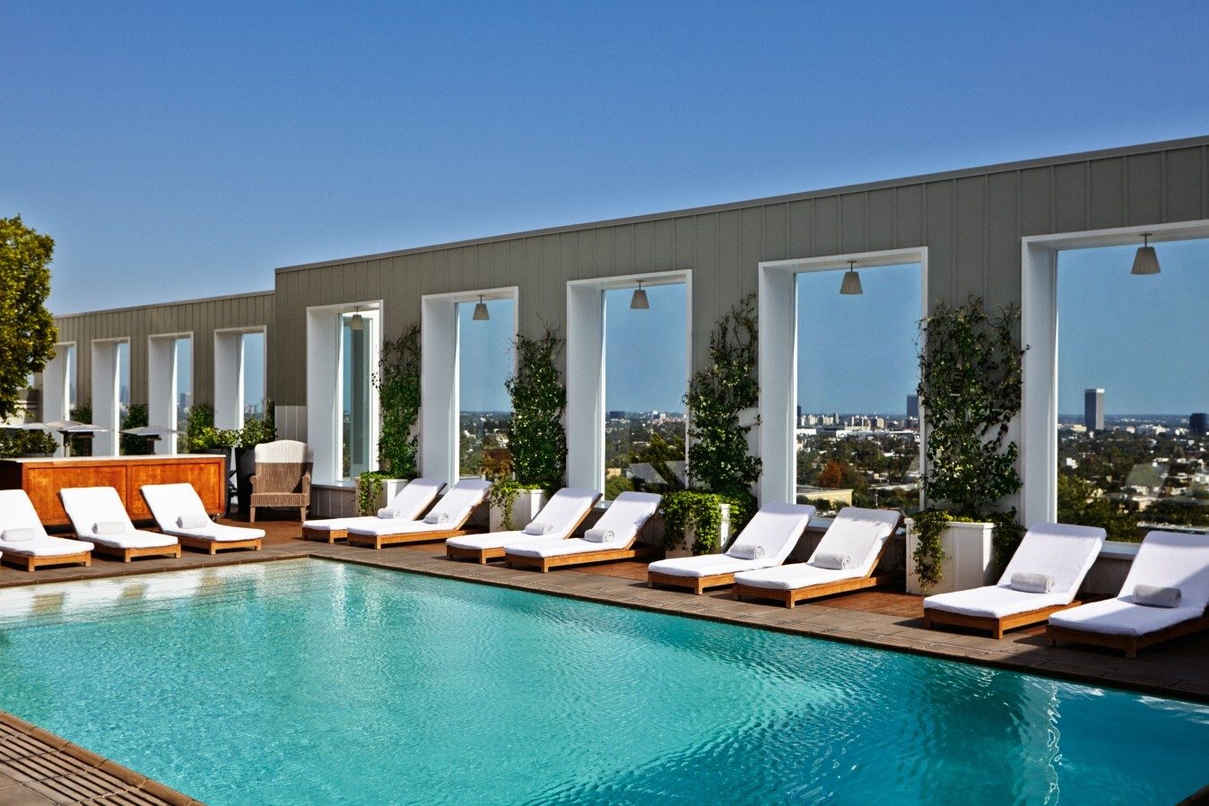 Swimming pool, Interior design, Outdoor furniture, Water, Sky, Plant, Azure, Shade, Rectangle, Tree