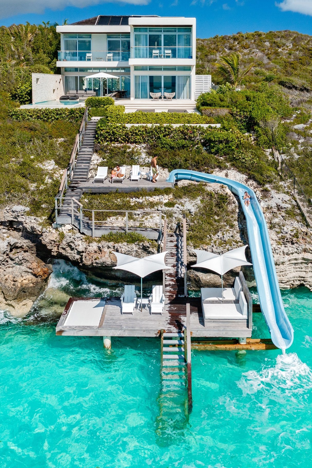 Coastal and oceanic landforms, Water, Blue, Sky, Building, Green, Azure, Window, Travel, Leisure