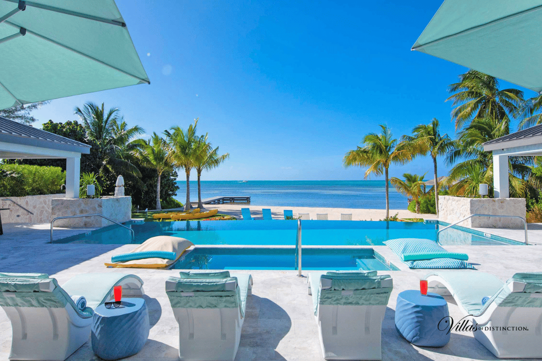 Seaside resort, Swimming pool, Water, Sky, Property, Blue, Azure, Plant, Shade, Sunlounger