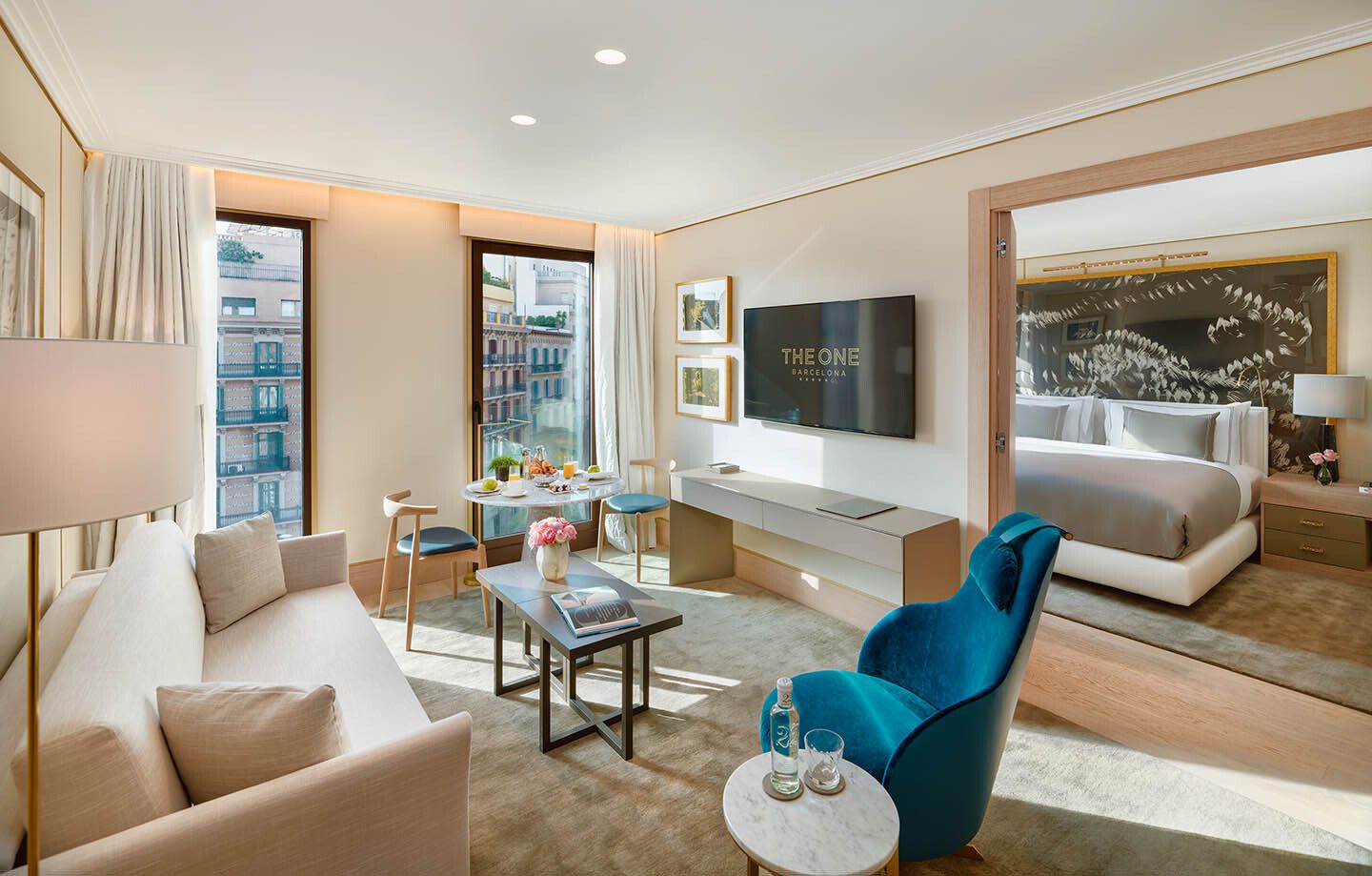 Picture frame, Interior design, Furniture, Couch, Table, Property, Comfort, Azure, Lighting, Houseplant