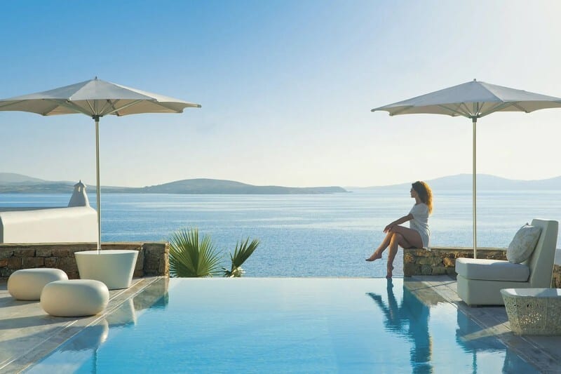 Swimming pool, Outdoor furniture, Seaside resort, Water, Sky, Azure, Sunlounger, Shade, Building, House