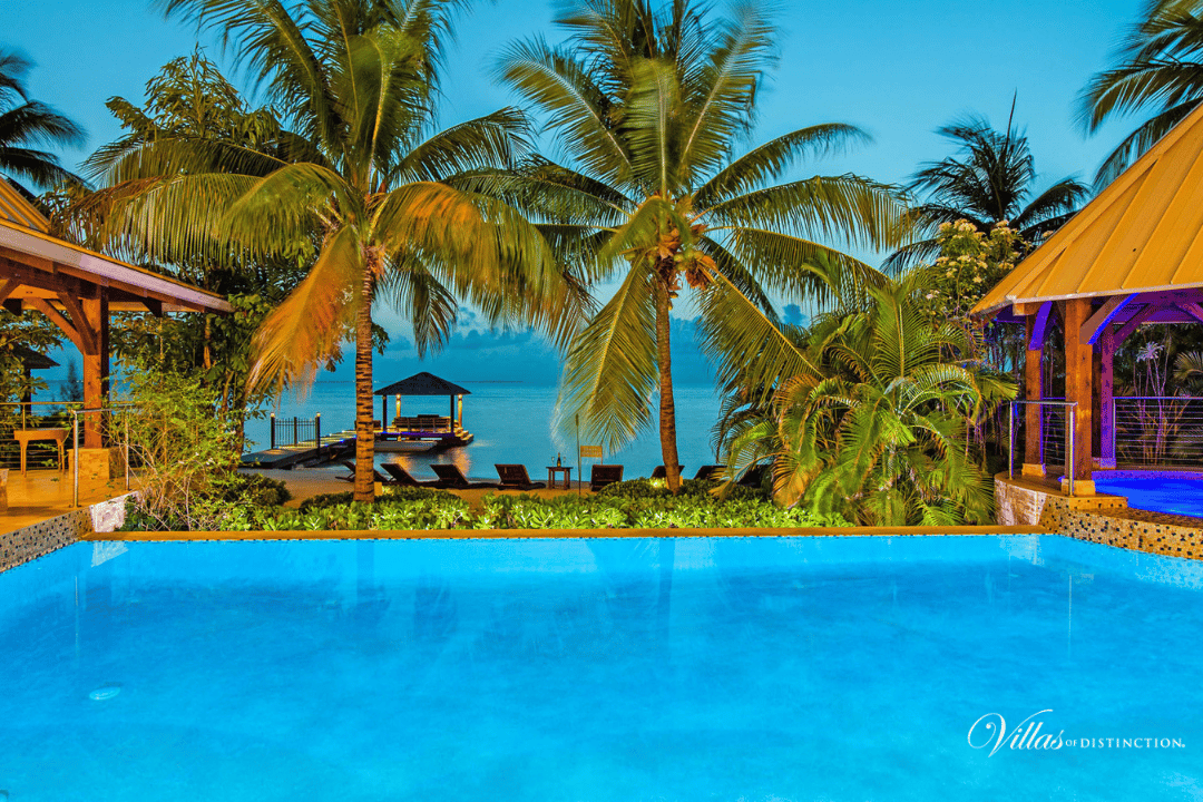 Seaside resort, Swimming pool, Water, Sky, Plant, Property, Nature, Azure, Blue, Tree