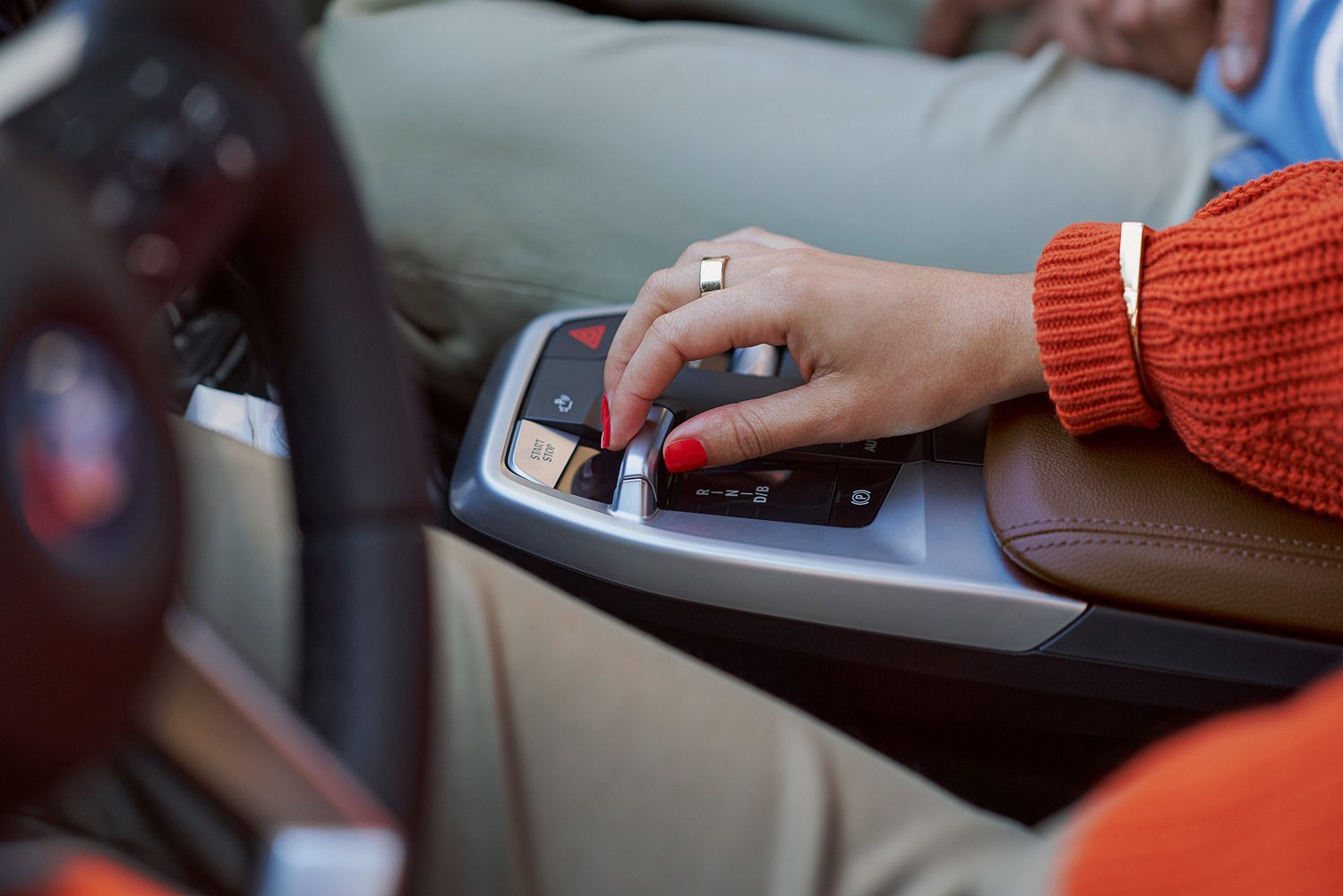 Personal luxury car, Motor vehicle, Automotive design, Steering wheel, Dress, Nail