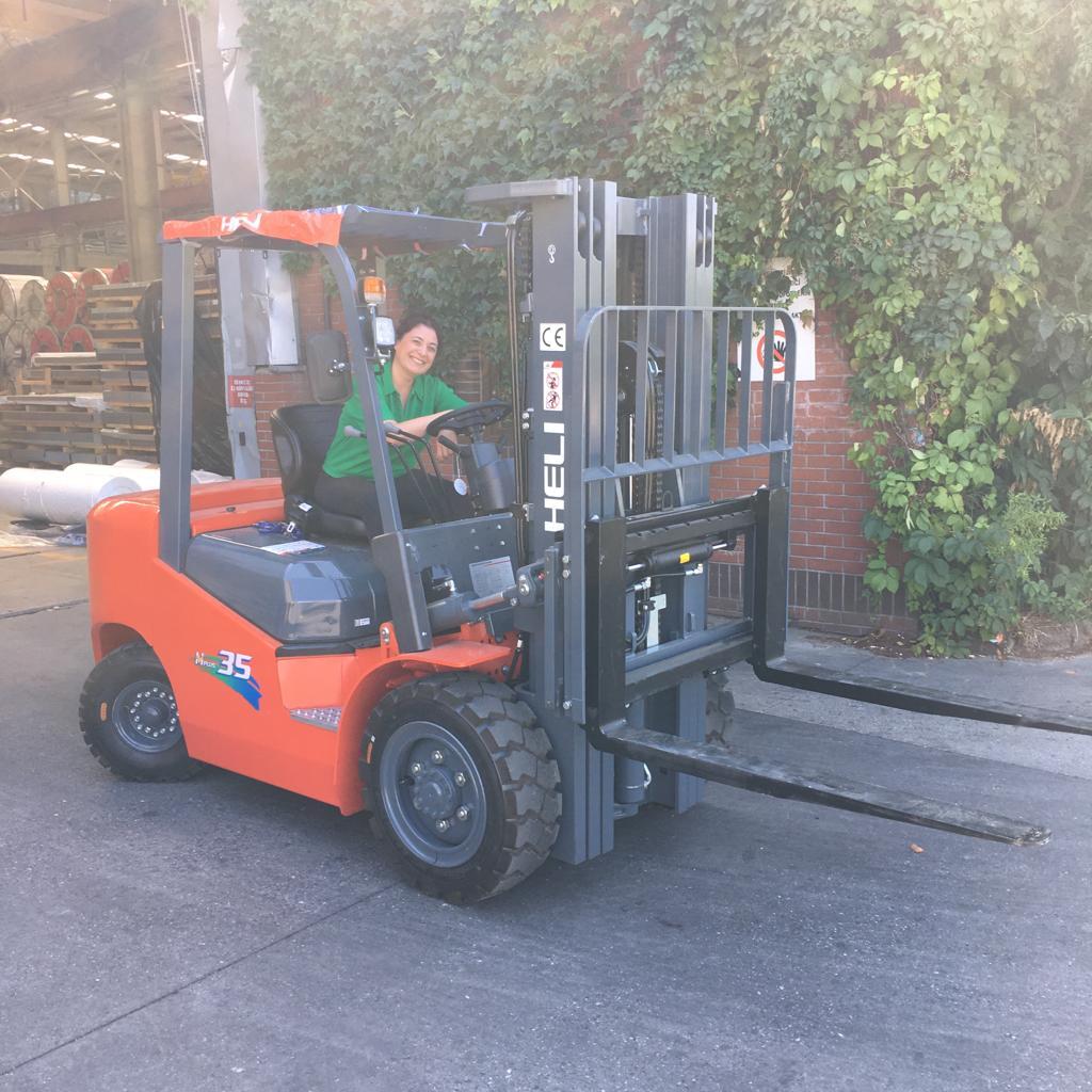 Forklift truck, Motor vehicle, Automotive tire, Road surface, Wheel, Tread, Asphalt, Plant