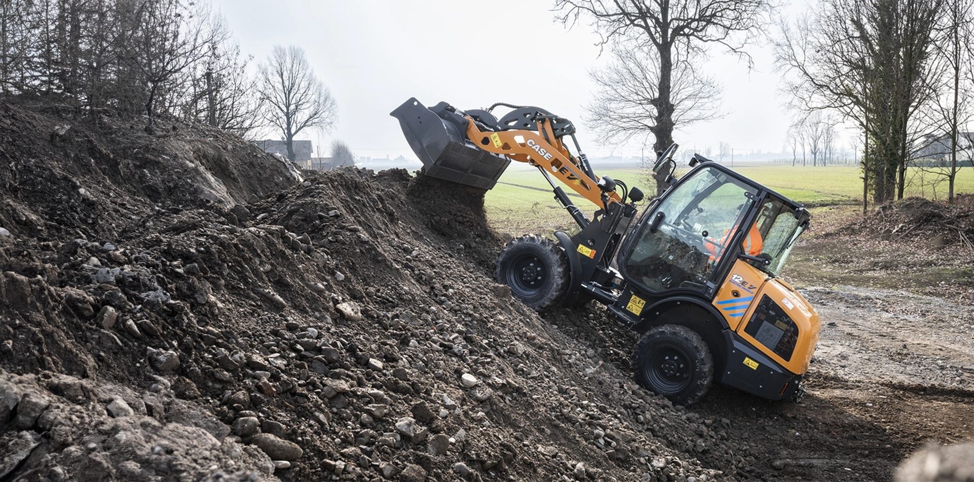 Automotive tire, Wheel, Sky, Vehicle, Plant, Tree, Slope, Cloud, Wood