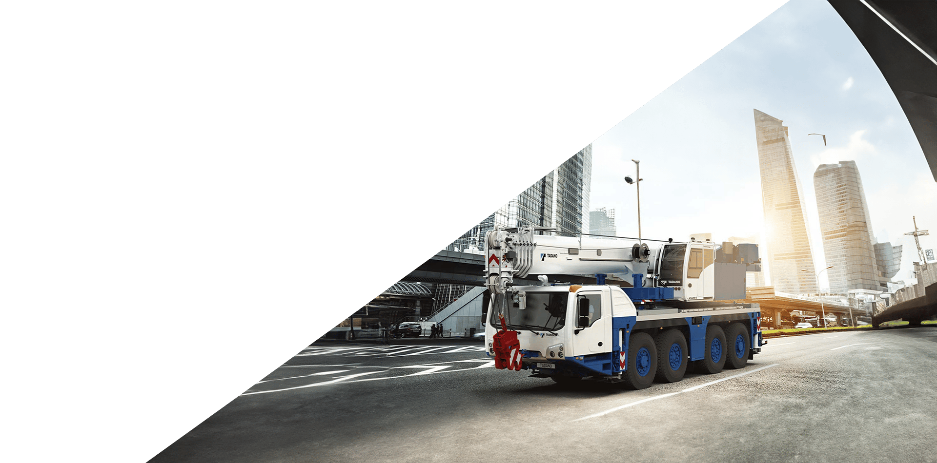 Automotive tire, Motor vehicle, Wheel, Truck, Asphalt, Sky, Rolling