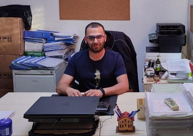 Vision care, Automotive design, Table, Blue, Eyewear, T-shirt, Desk, Beard