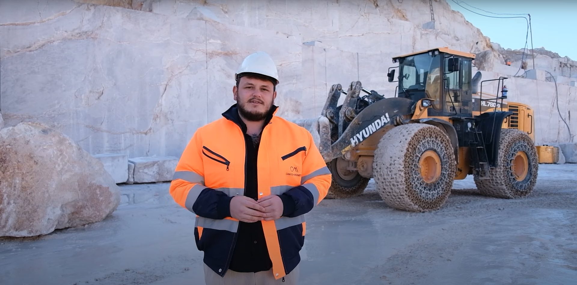 High-visibility clothing, Hard hat, Automotive tire, Motor vehicle, Wheel, Workwear, Sleeve, Asphalt