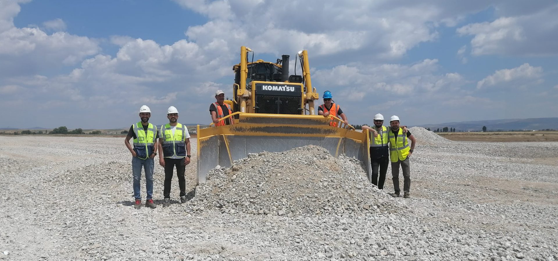 High-visibility clothing, Road surface, Cloud, Sky, Tire, Vehicle, Wheel, Asphalt, Slope
