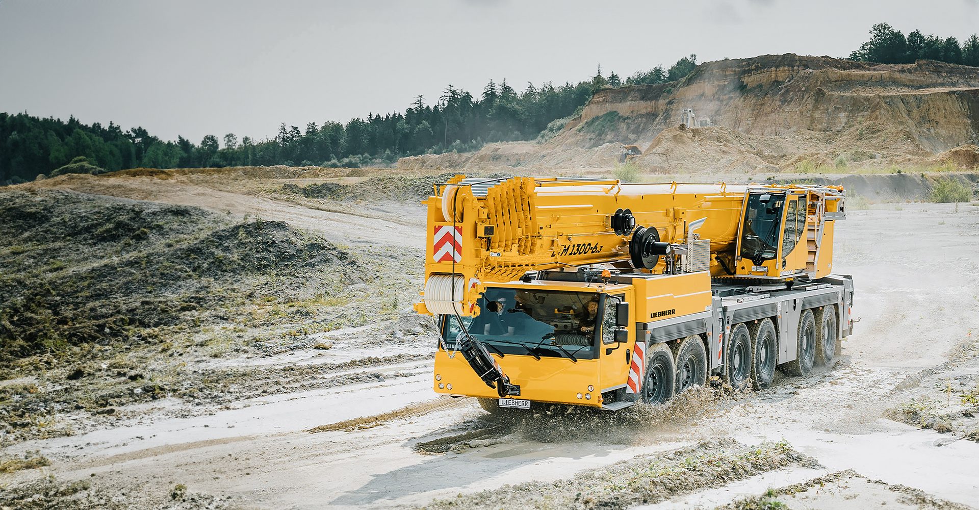Mode of transport, Automotive tire, Motor vehicle, Road surface, Sky, Wheel, Tree, Asphalt, Slope