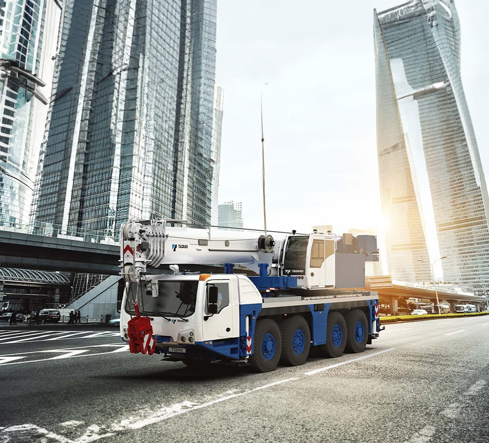 Motor vehicle, Automotive tire, Skyscraper, Building, Sky, Wheel, Tower, Truck