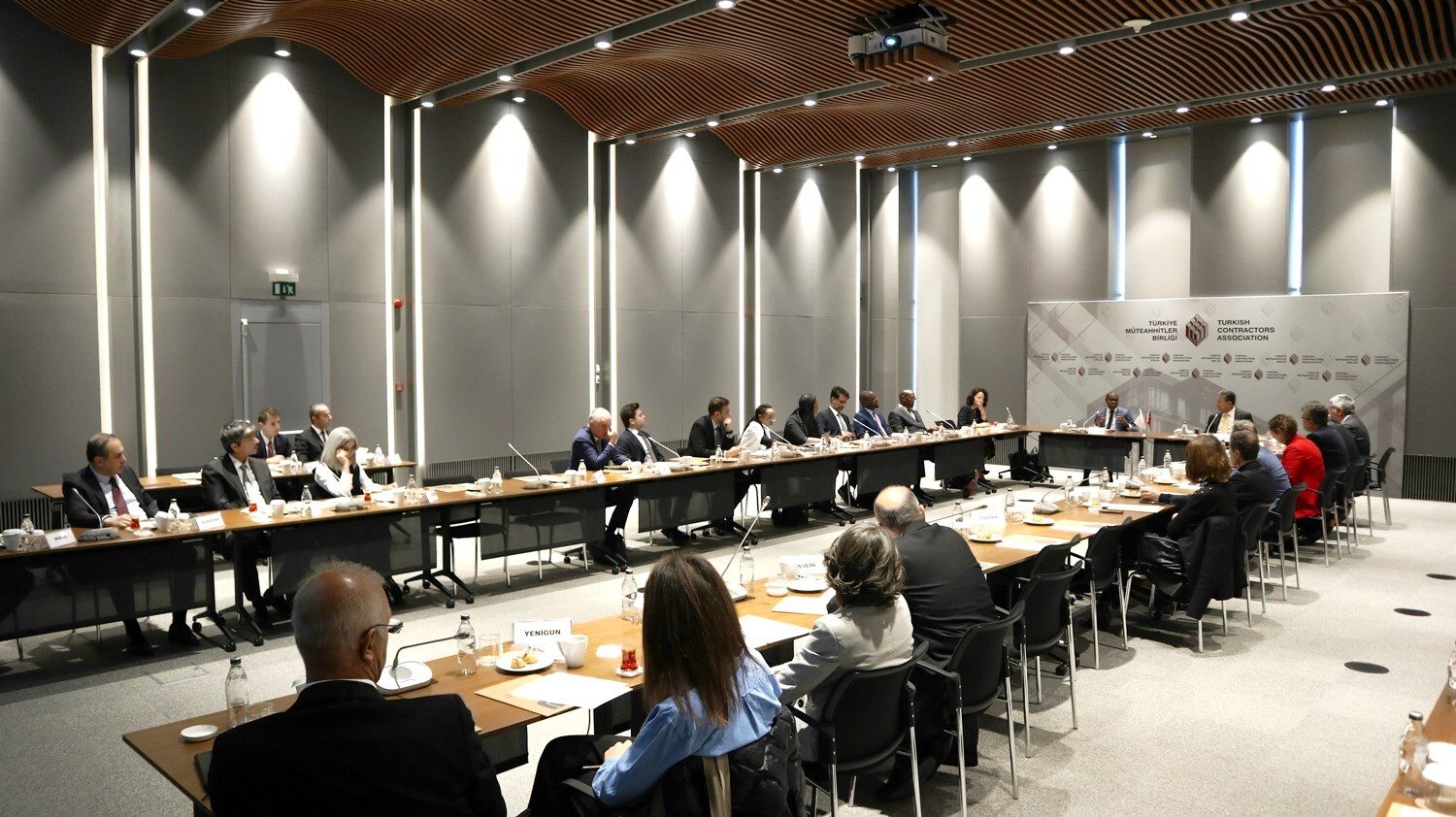 Interior design, Table, Building, Desk, Chair, Coat, Suit