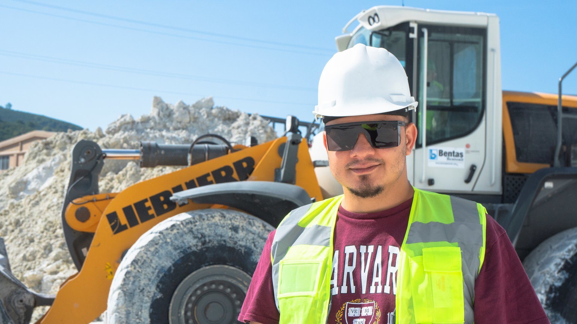 Hard hat, Motor vehicle, Tire, Sky, Workwear, Wheel, Helmet, Goggles, Sunglasses