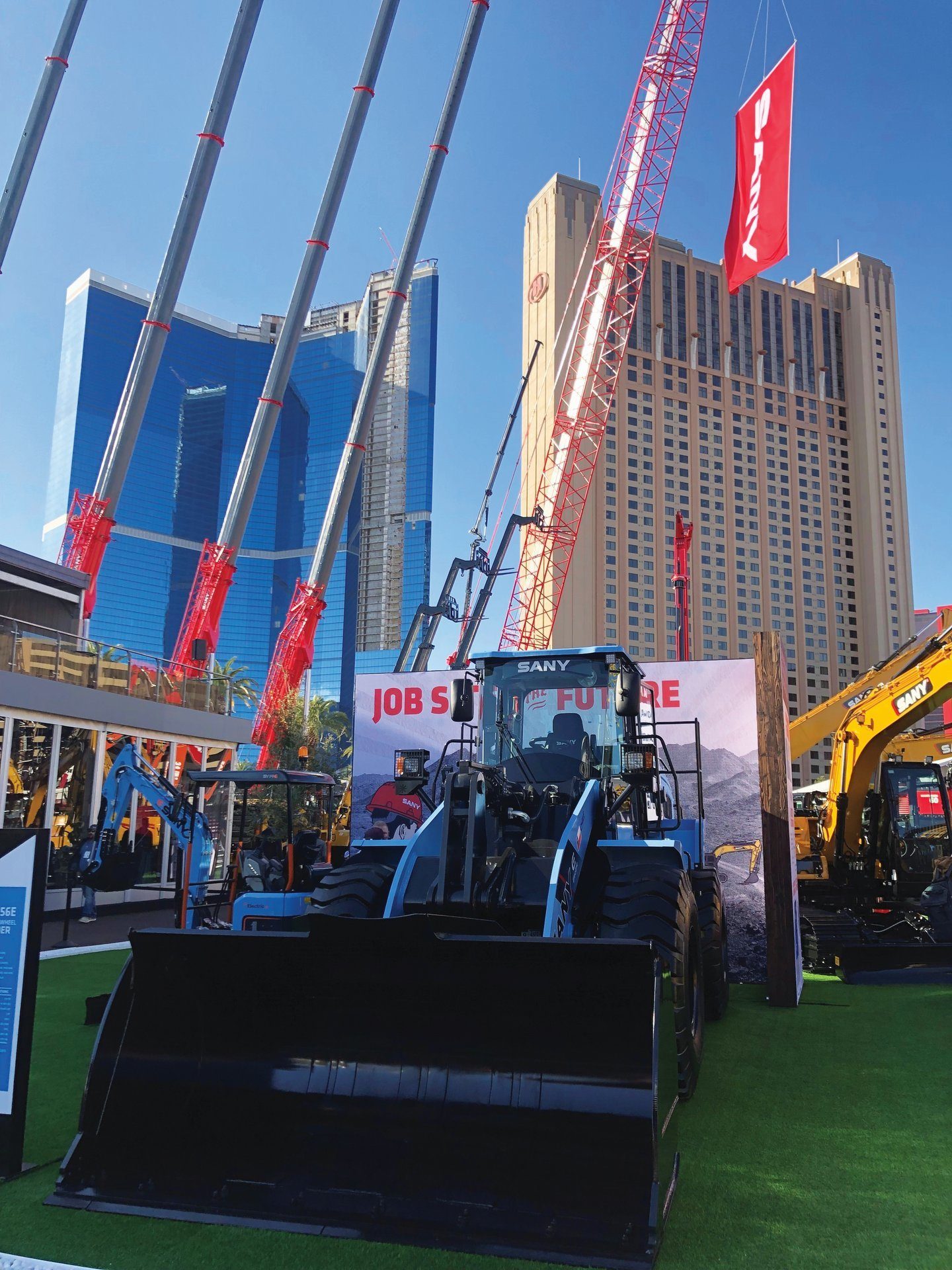 Automotive tire, Motor vehicle, Sky, Building, Skyscraper, Wheel, Flag, Truck