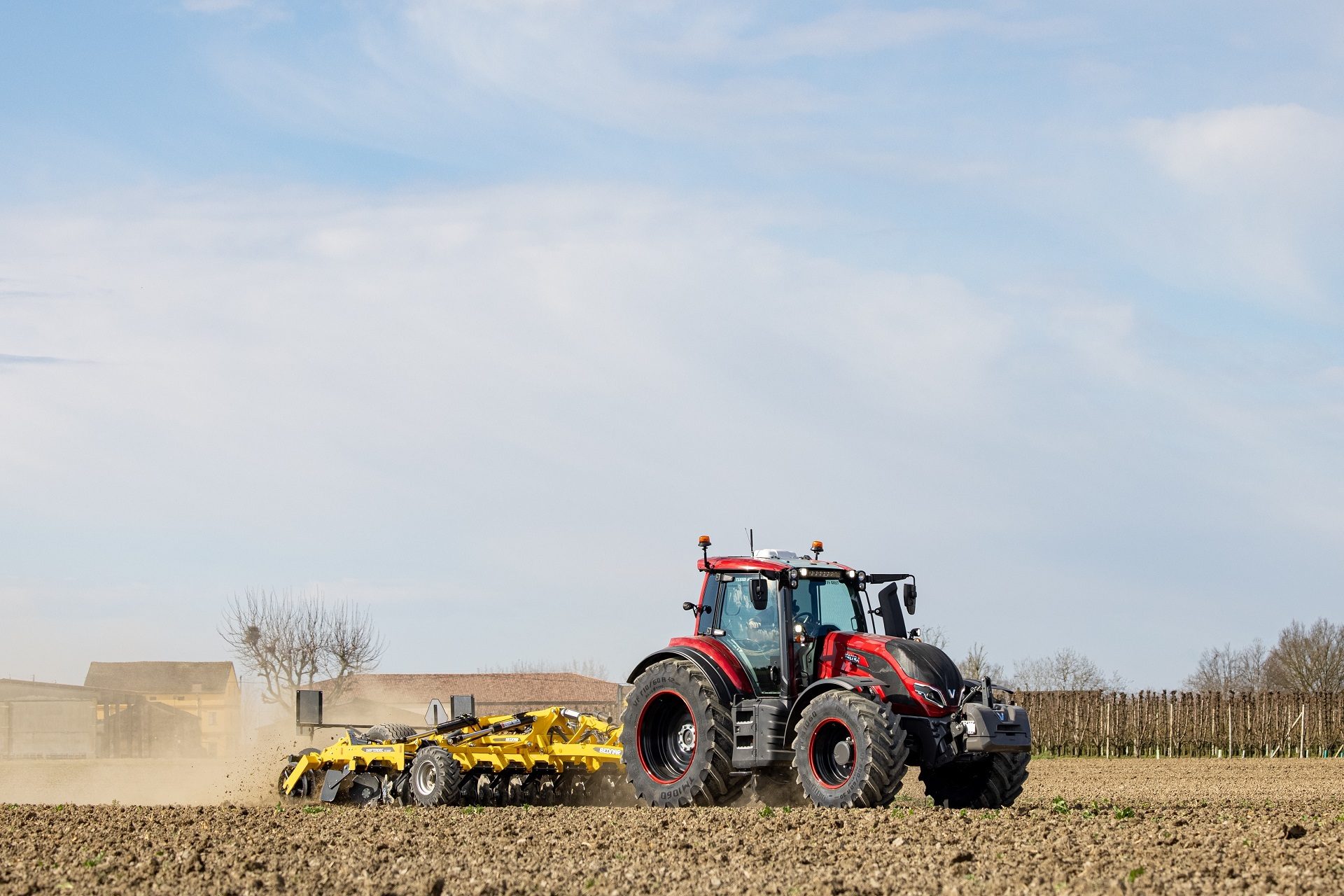 Automotive tire, Motor vehicle, Agricultural machinery, Wheel, Sky, Tractor, Cloud, Plant