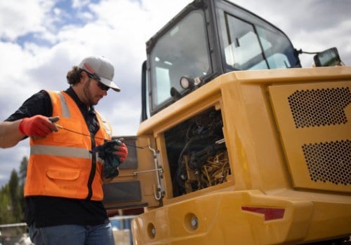 Hard hat, High-visibility clothing, Automotive tire, Motor vehicle, Sky, Cloud, Hood, Workwear, Helmet