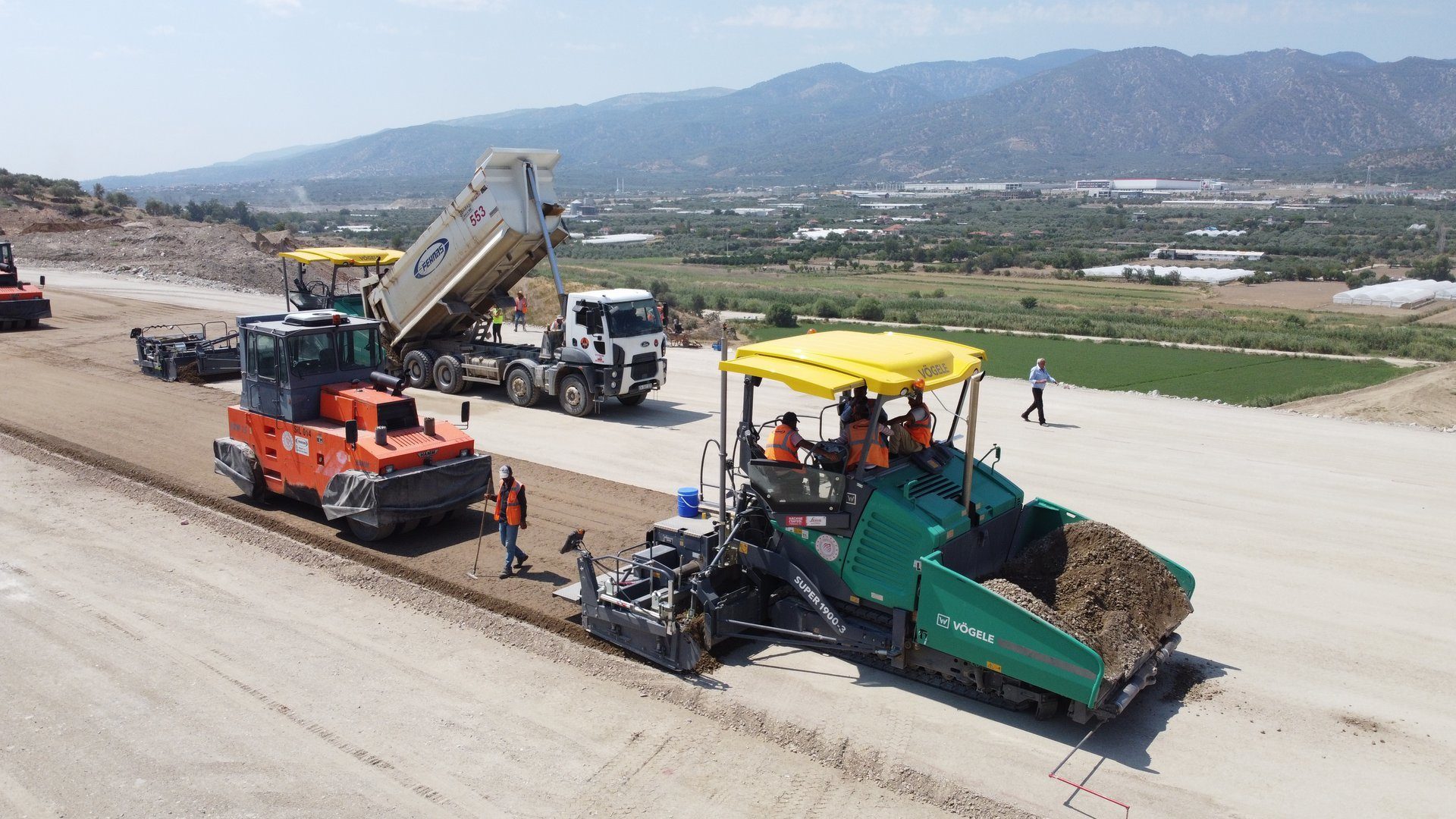 Motor vehicle, Road surface, Automotive tire, Wheel, Sky, Plant, Asphalt, Rolling