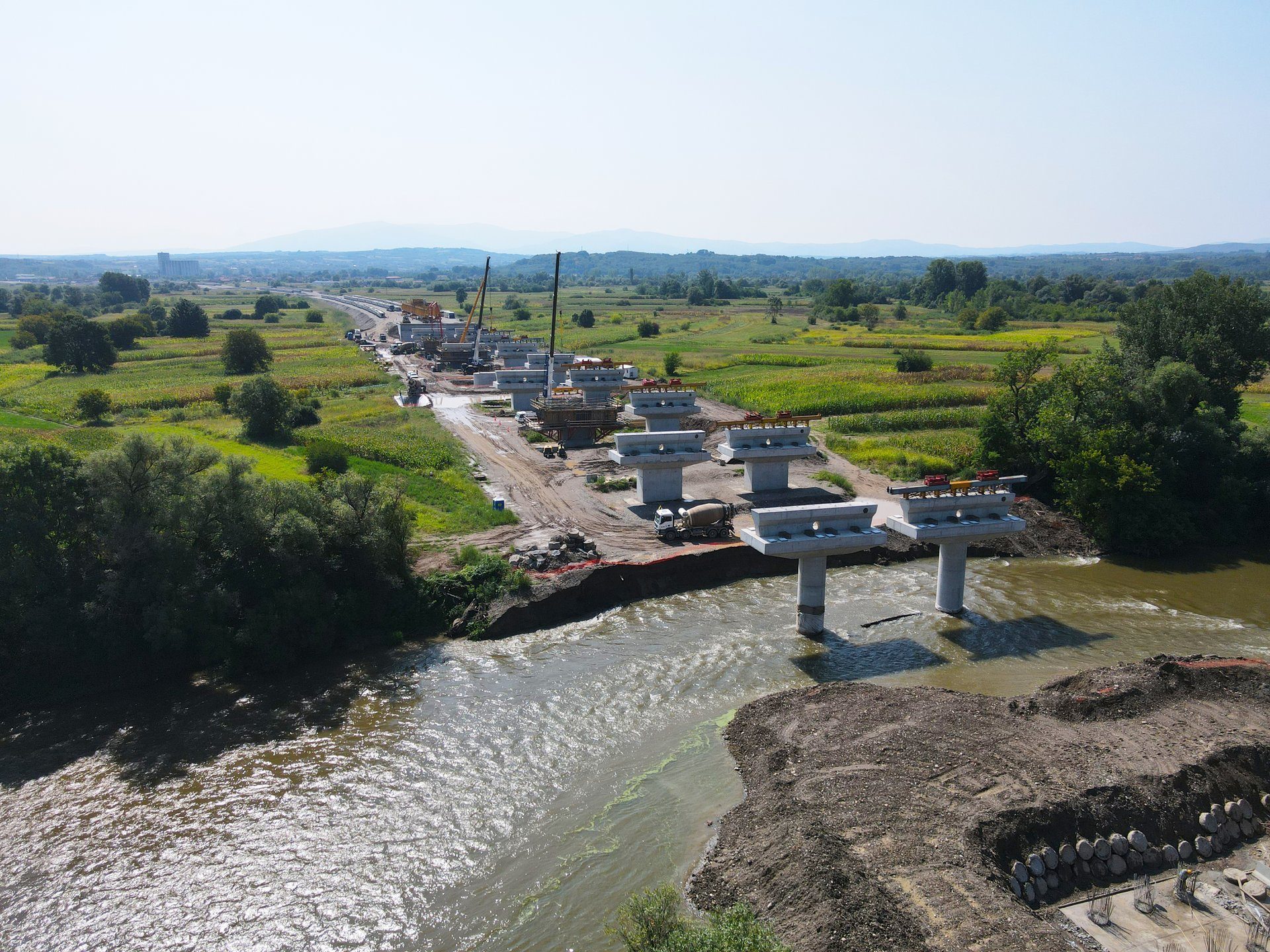 Water resources, Natural landscape, Land lot, Urban design, Sky, Plant, Tree, Watercourse, Bank