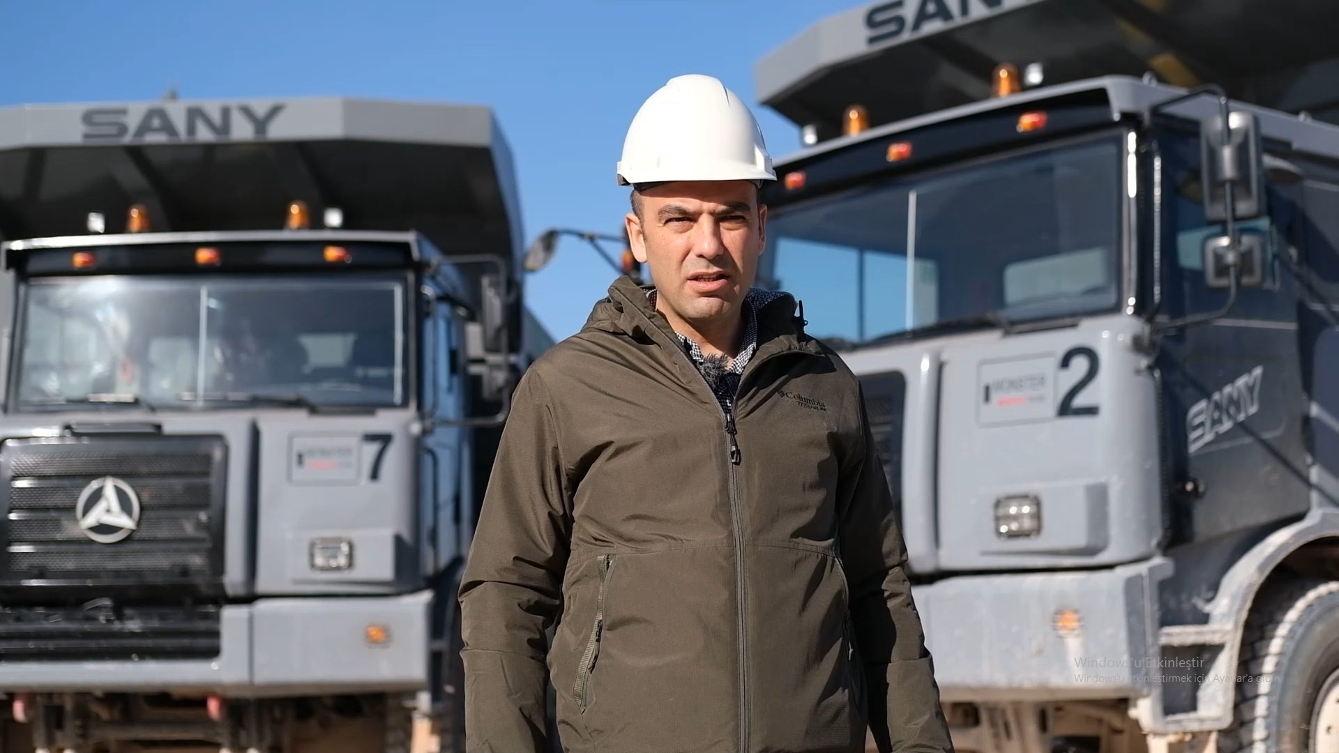 Hard hat, Motor vehicle, Automotive tire, Workwear, Helmet, Sky, Asphalt, Engineer