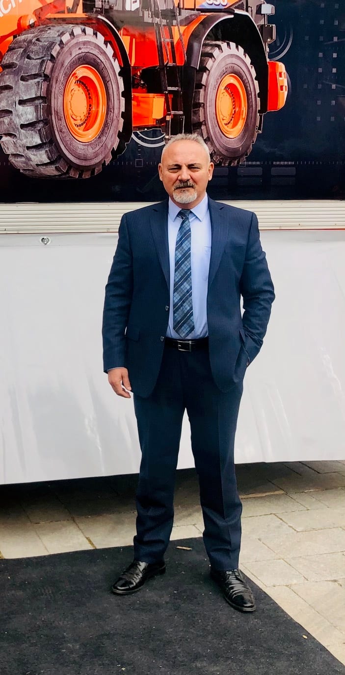 Suit trousers, Automotive tire, Dress shirt, Photograph, Wheel, Tie, Tread, Sleeve, Standing