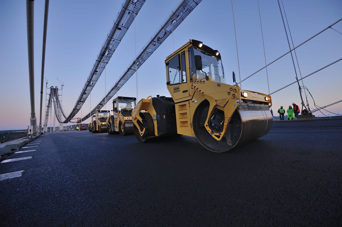 Automotive tire, Road surface, Motor vehicle, Wheel, Sky, Asphalt, Rolling