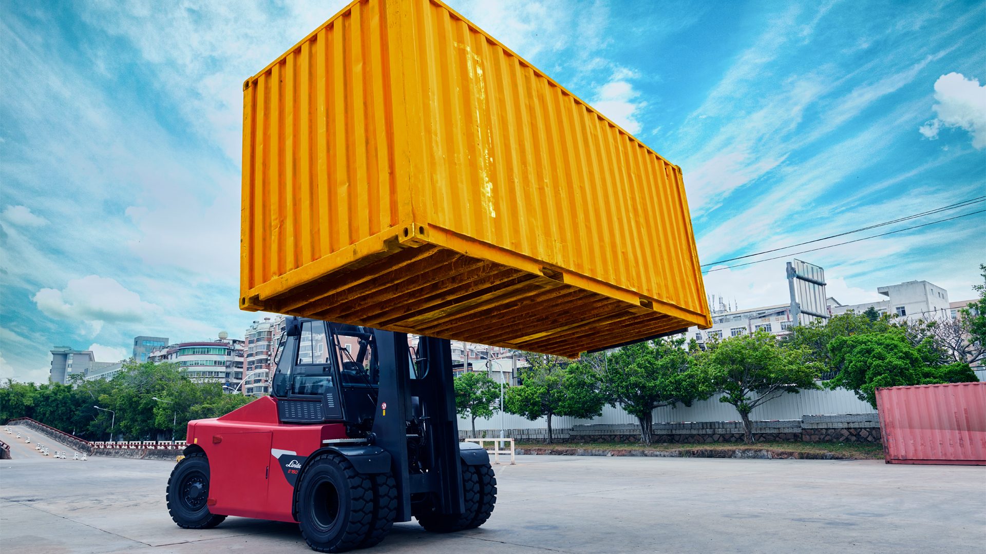 Forklift truck, Automotive tire, Cloud, Sky, Wheel, Vehicle, Tread, Blue, Tree