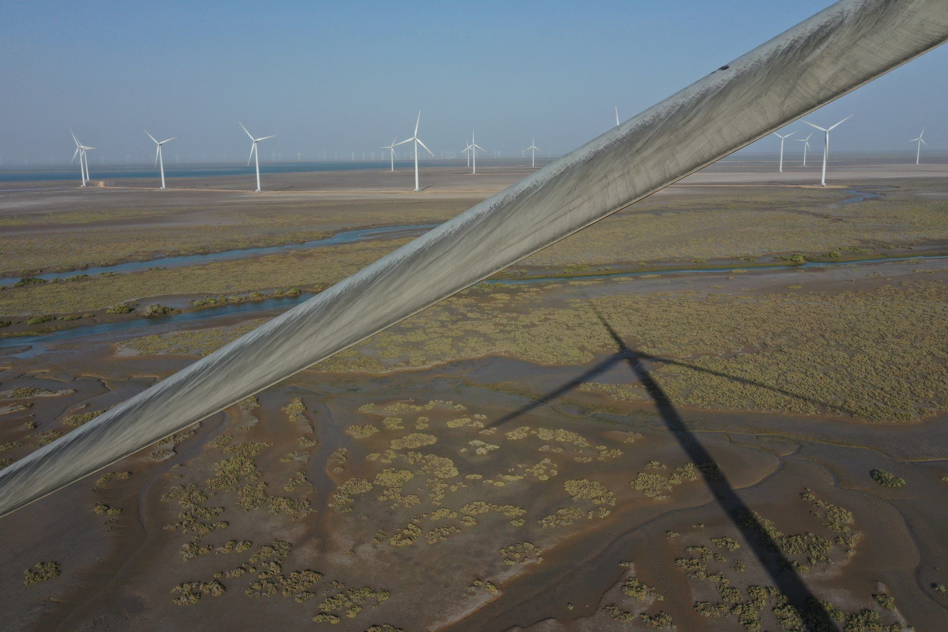 Natural environment, Atmospheric phenomenon, Land lot, Wind turbine, Sky, Ecoregion, Light, Windmill, Line