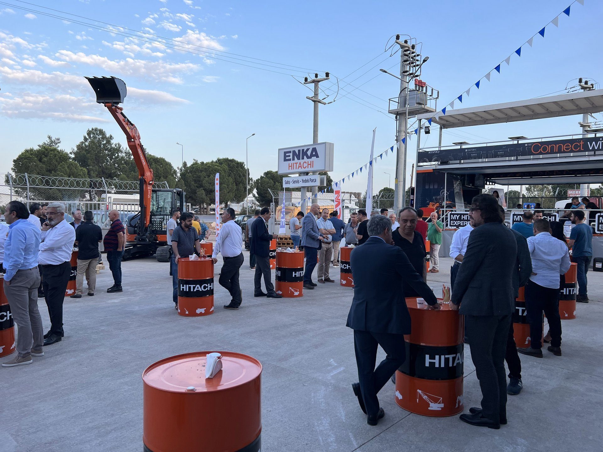 Musical instrument, Motor vehicle, Road surface, Public space, Sky, Trousers, Cloud, Infrastructure, Asphalt, Tire